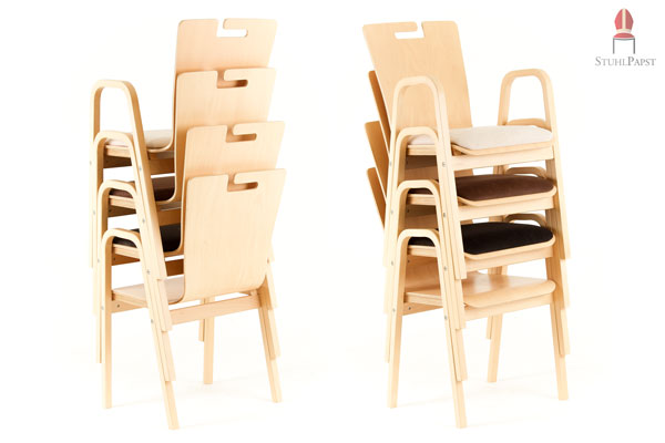 Stapelbare Armlehnenschalenstühle aus Holz mit Kunstlederpolster und Taschenhalterung